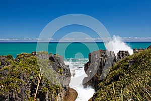 Surf in blowhole Pancake Rocks of Punakaiki, NZ