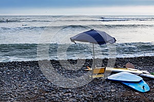 Surf boards and beach umbrella