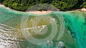 Surf coast on green bowl beach. Aerial view.