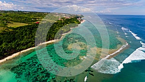 Surf coast on green bowl beach. Aerial view.