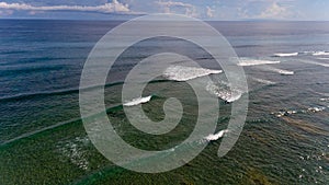 Surf coast on green bowl beach. Aerial view.