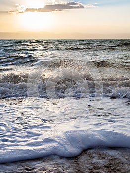 Surf at Dead Sea in winter dusk