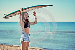 Surf girl go to surfing- women holding a surfboard Vacation. Ext