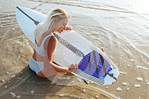 Surf girl with long hair go to surfing.