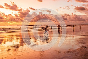 Surf girl at sunset.