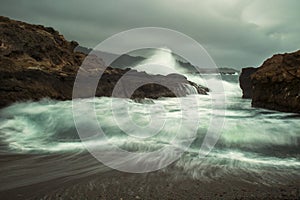 Surf Motion onto Pebbled Beach with Spray in California Seascape