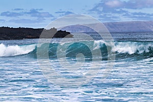 Surf at a popular surf spot on Maui called Dumps