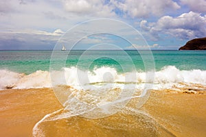 Waves meeting a pristine beach in the windward islands