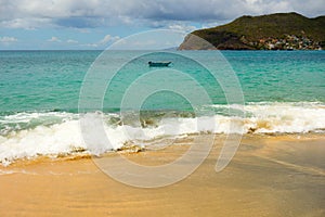 Waves meeting a pristine beach in the windward islands