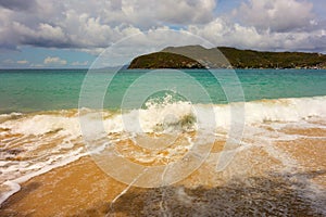 Waves meeting a pristine beach in the windward islands