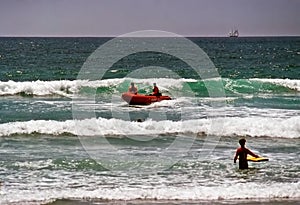 Surf rescue in boat on coast of California