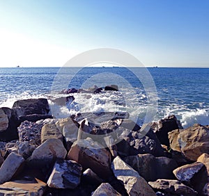 Surf at rock beach at the small cove of Black sea photo