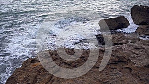 Surf at Rocky Coastline with Foamy Water