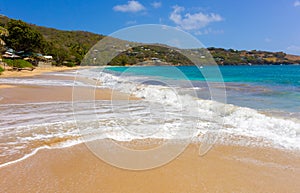 The surf rolling ashore in the windward islands