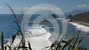 Surf rolls in at nine mile, near greymouth, on the west coast of new zealand