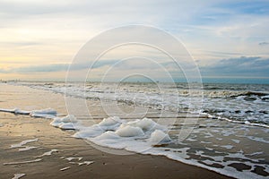 The surf of the sea with lots of foam.