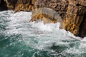 Surf sea waves motion on rock photo
