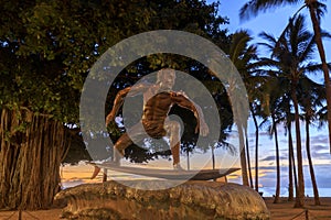 Surf statue on Queen's Beach area of downtown Waikiki Honolulu, Oahu, Hawaii