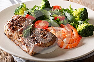Surf and Turf. Beef steak with royal prawns and fresh vegetables
