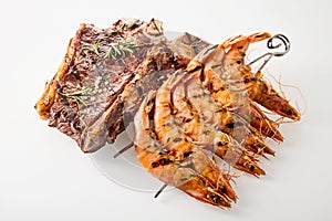 Surf and turf T-bone steak and prawns