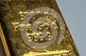 The surface of 5000 grams gold bullion.