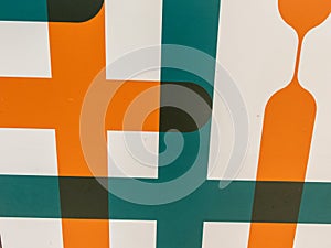 The surface is adorned with mesmerizing patterns of orange-green lines, creating a visually captivating and vibrant display.