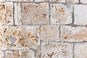 Surface of ancient wall of natural stone