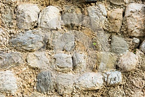 Surface of ancient wall of natural stone