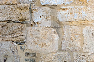 Surface of ancient wall of natural stone