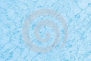 Surface of blue clear swimming pool. Water background pattern for background