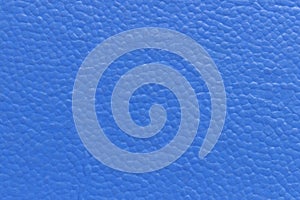 The surface of the blue old worn dermatin