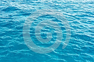Surface blue sea water. Texture of water with small waves.