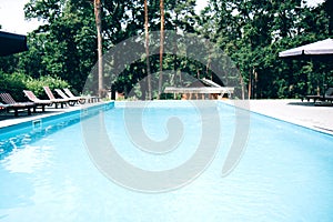 Surface of blue swimming pool. Background of water in swimming pool