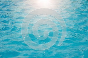 Surface of blue swimming pool background of water in swimming pool. Simulate natural wave ocean water texture summer or abstract