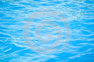 Surface of blue swimming pool background of water in swimming pool. Simulate natural wave ocean water texture summer or abstract