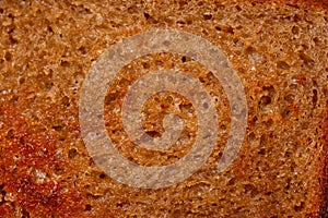 The surface of bread fried in butter with a crispy crust. Close-up texture