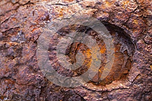 The surface of the broken metal rusts.