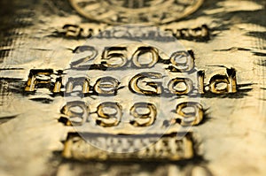 The surface of cast gold bullion.