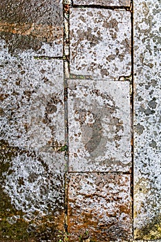 The surface of the cobblestones is covered with ice