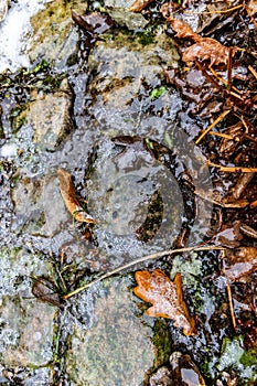 The surface of the cobblestones is covered with ice