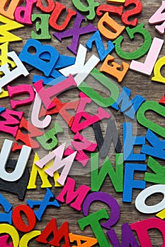 Surface covered with multiple colored wooden letters