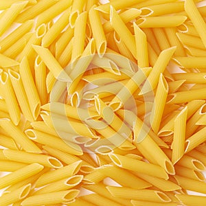 Surface covered with penne pasta