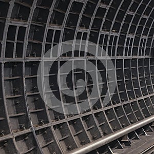 Surface of deep-running underground tunnel with bolted joints of prefabricated reinforced lining.