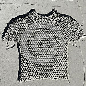 Surface with an embossed pattern resembling a knitted or crocheted