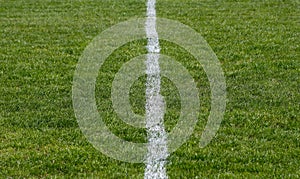The surface of a football field with clipped grass