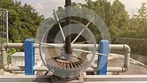 The surface of a gear wheel in a dam`s water discharge regulator machine