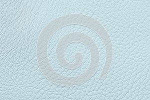 Surface of genuine leather close-up, pastel blue color. Background, texture