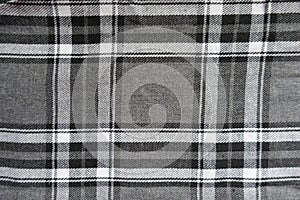 Surface of gray, black and white flannel tartan fabric
