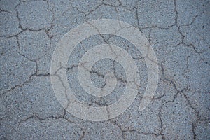 Surface of grey cracked asphalt. Tarmac, road. Texture Background, Top view.