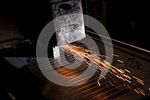 Surface grinding, sparks from abrasive stone, metal processing